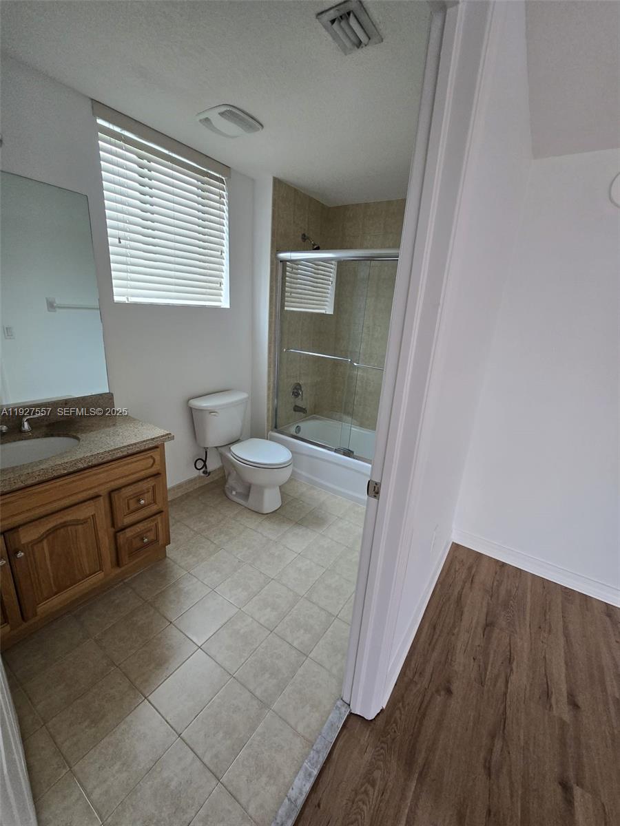 4242 Northwest 2nd Street, Unit 1614 Miami, FL 33126 - Photo 16 of 24 a bathroom with a sink and a toilet