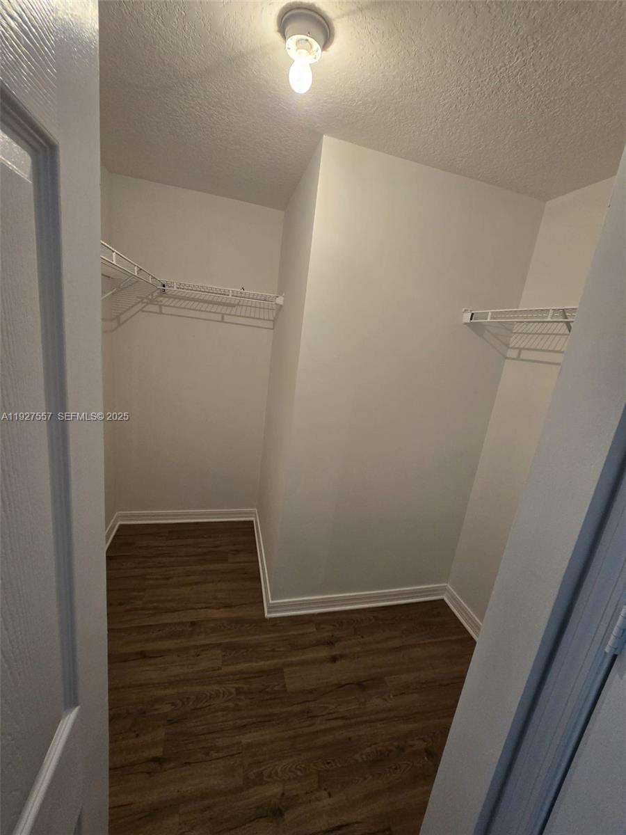 4242 Northwest 2nd Street, Unit 1614 Miami, FL 33126 - Photo 18 of 24 a view of walk in closet