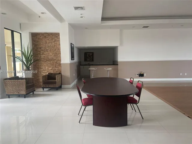 a dinning room with furniture and a fireplace