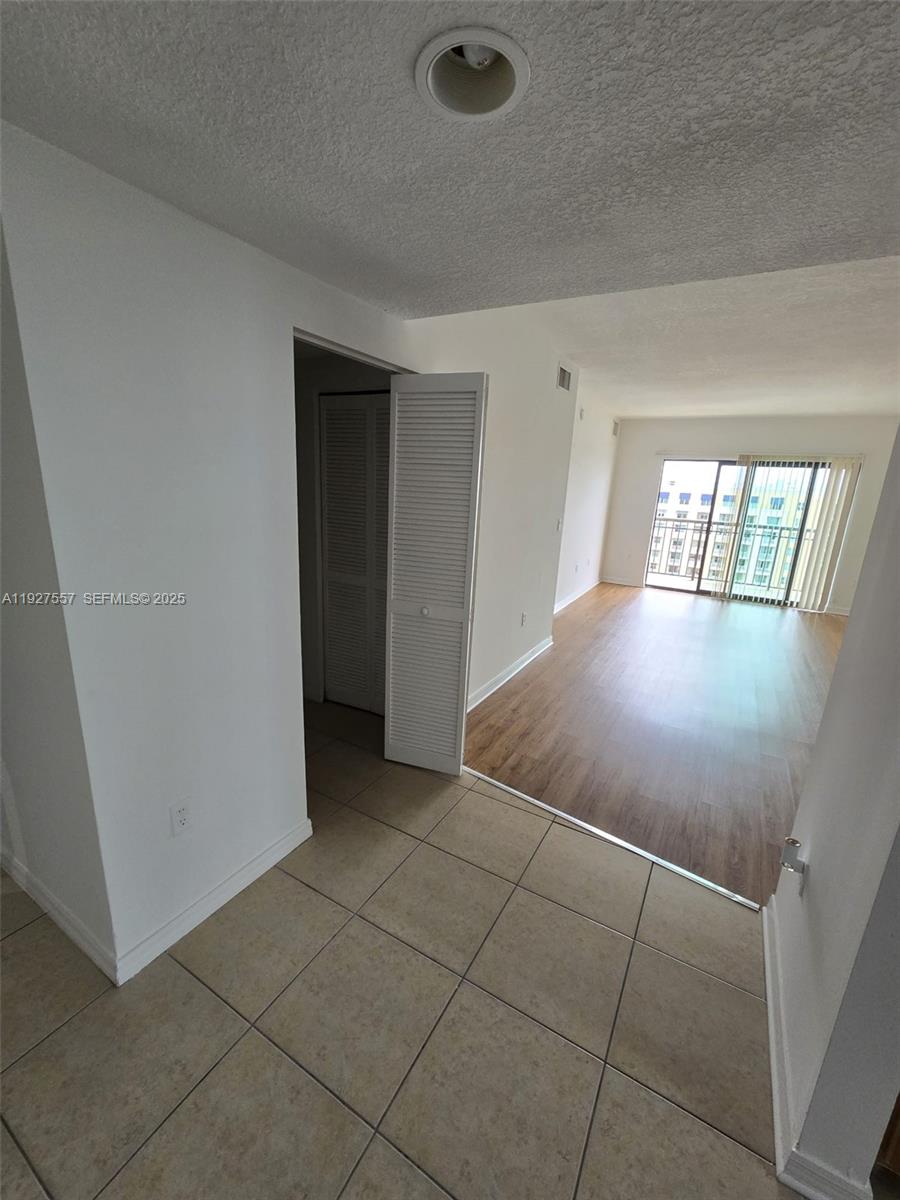 4242 Northwest 2nd Street, Unit 1614 Miami, FL 33126 - Photo 8 of 24 an empty room with windows