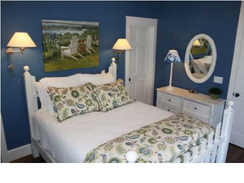 22 Round Road Rosemary Beach, FL 32461 - Photo 12 of 30 a bedroom with a bed and painting on the wall