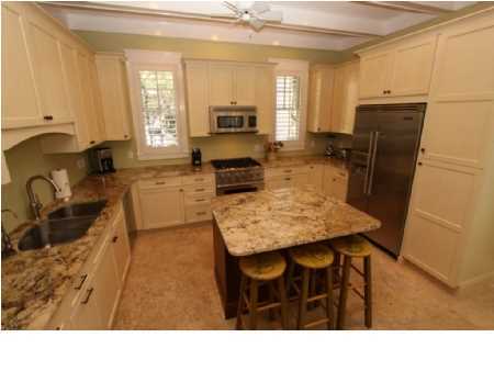 22 Round Road Rosemary Beach, FL 32461 - Photo 8 of 30 a kitchen with a table chairs refrigerator and microwave