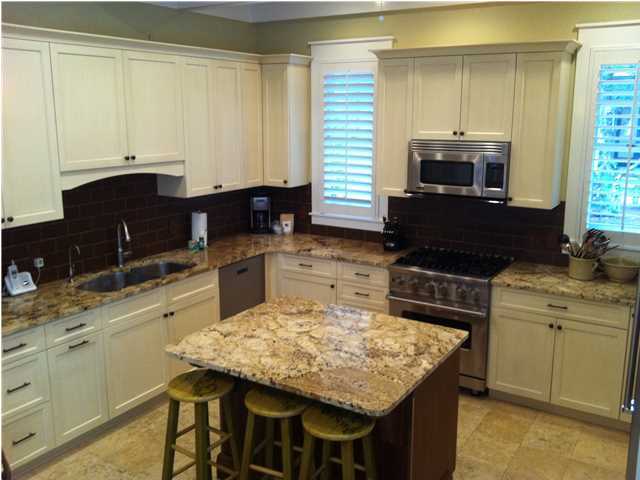 22 Round Road Rosemary Beach, FL 32461 - Photo 9 of 30 a kitchen with a stove top oven sink and cabinets