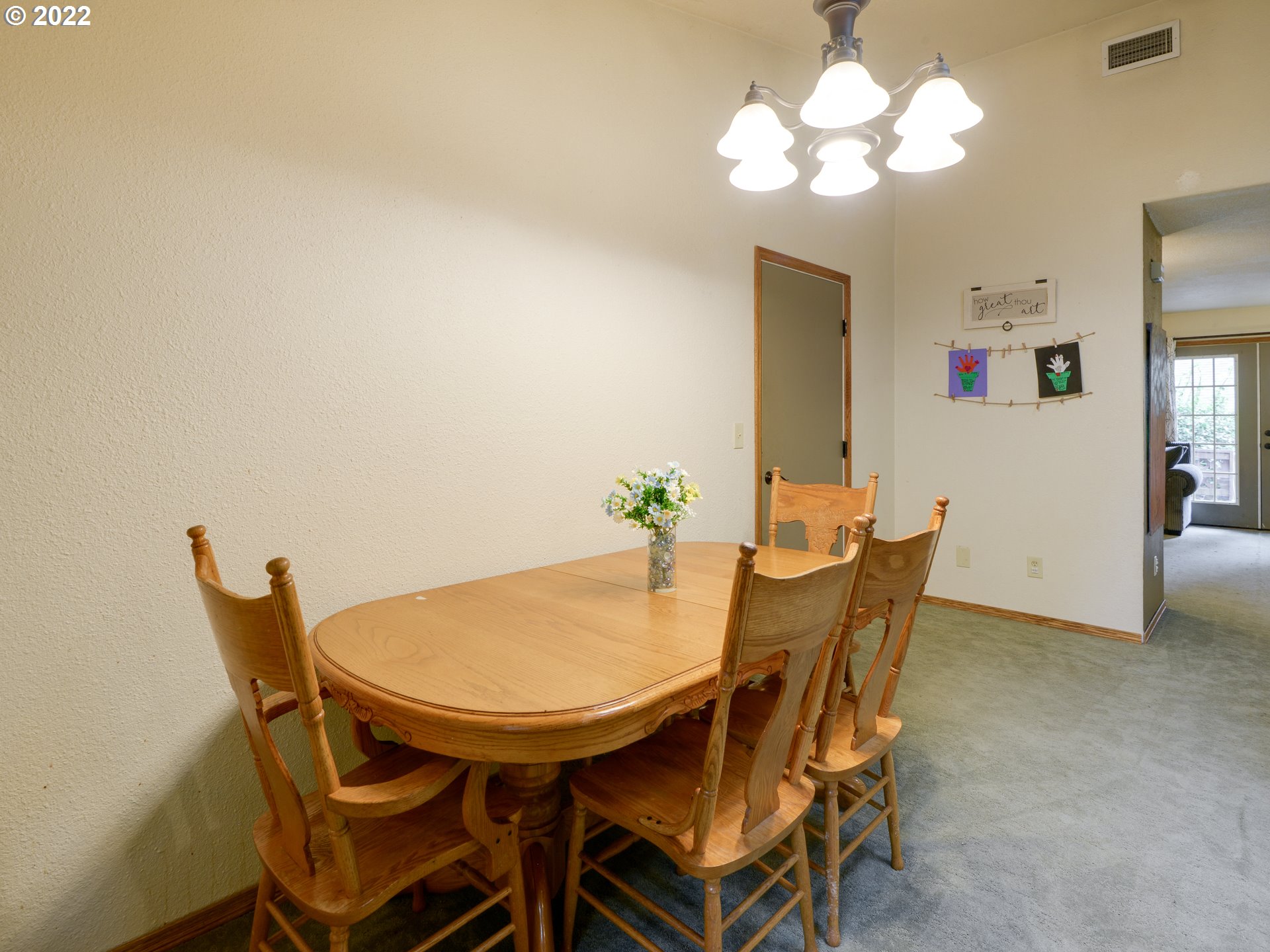 64911 East Sandy River Lane Rhododendron, OR 97049 - Photo 14 of 27 a view of a dining room with furniture and chandelier