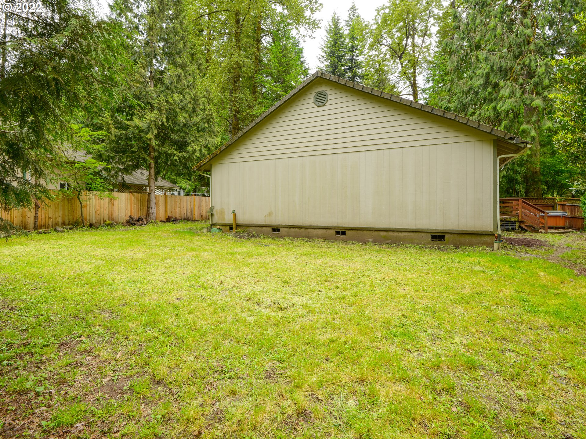 64911 East Sandy River Lane Rhododendron, OR 97049 - Photo 26 of 27 a view of an house with backyard space and garden