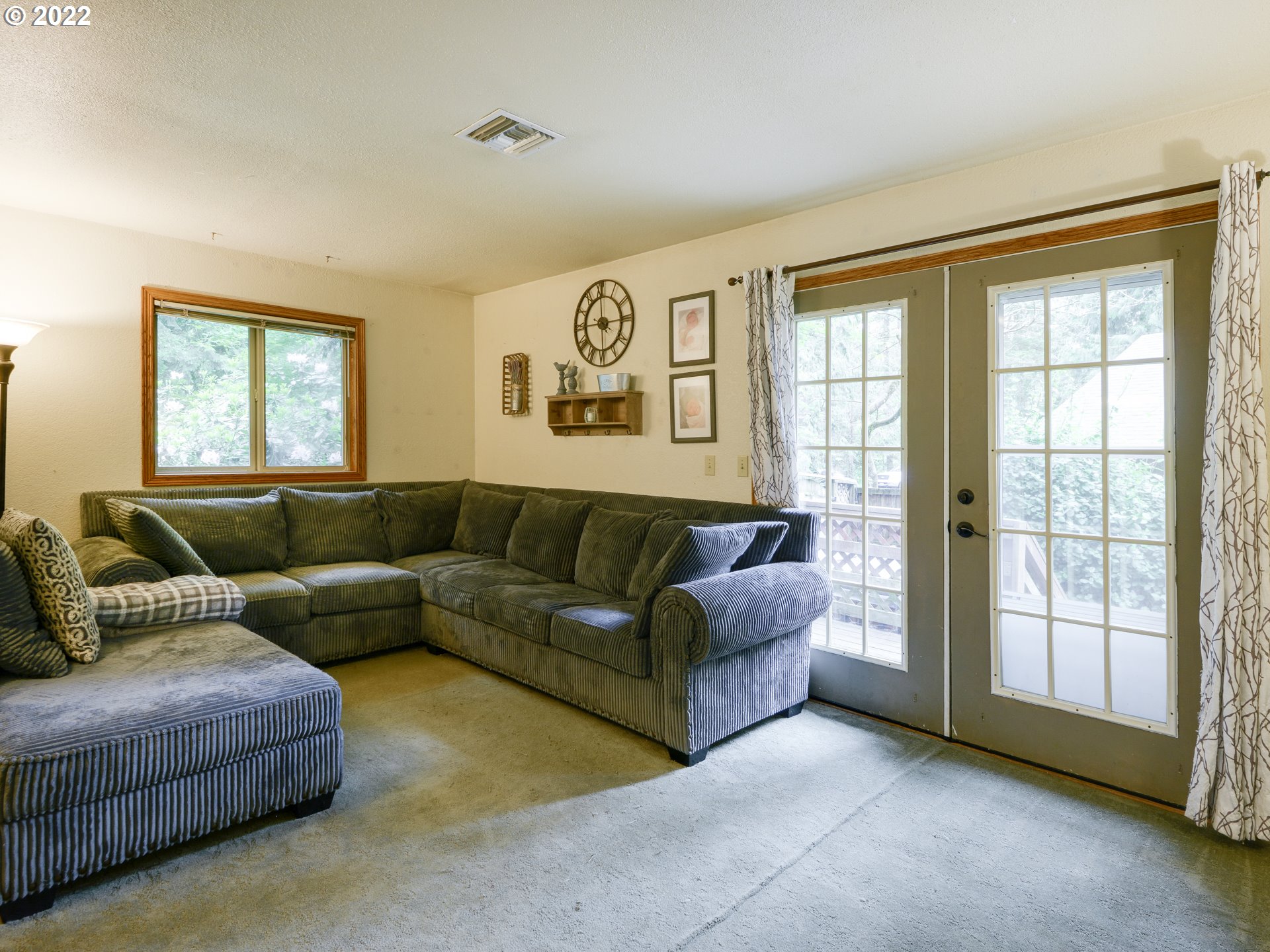 64911 East Sandy River Lane Rhododendron, OR 97049 - Photo 5 of 27 a living room with furniture and a large window