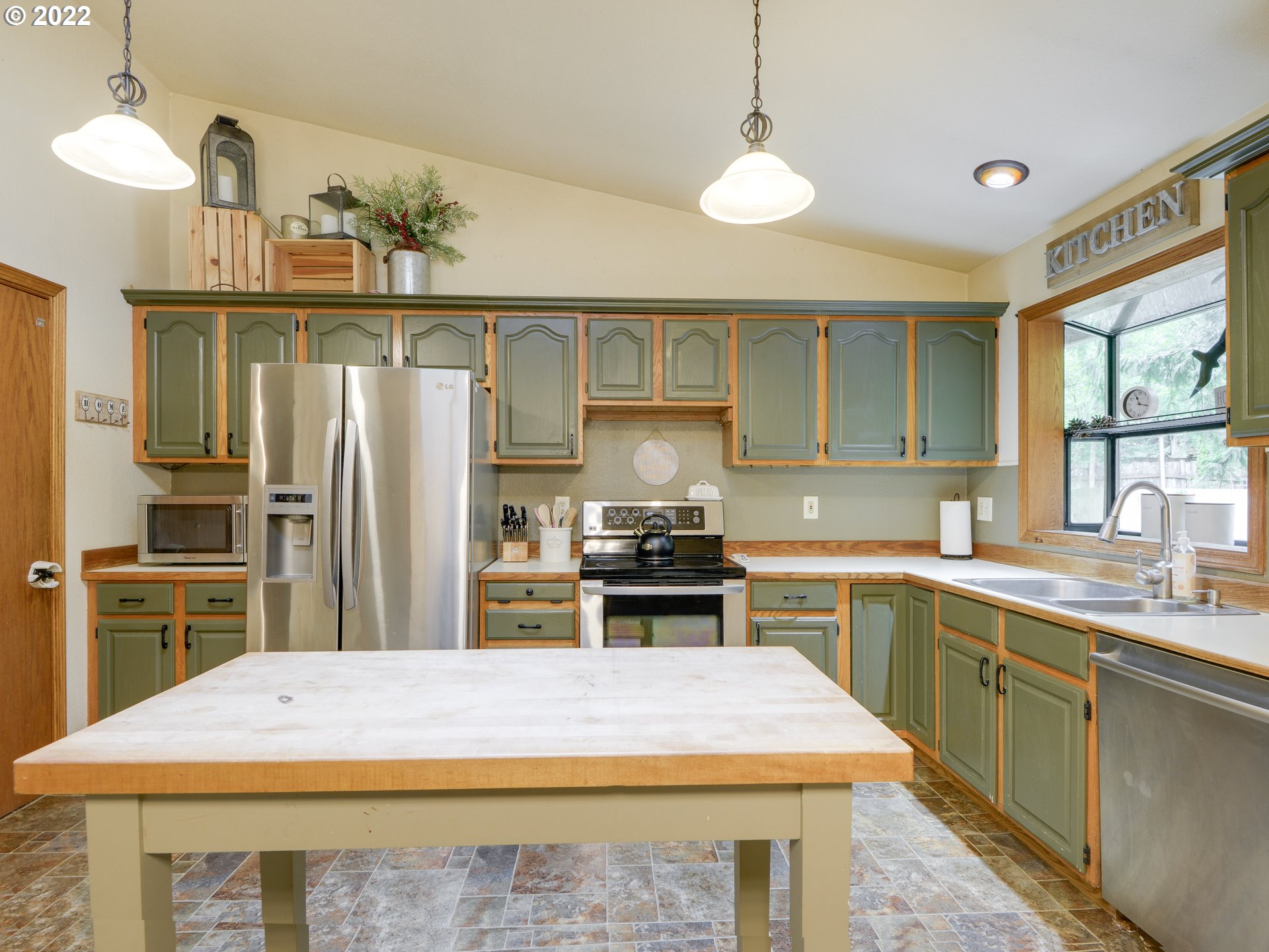 64911 East Sandy River Lane Rhododendron, OR 97049 - Photo 8 of 27 a kitchen with a sink a stove and refrigerator