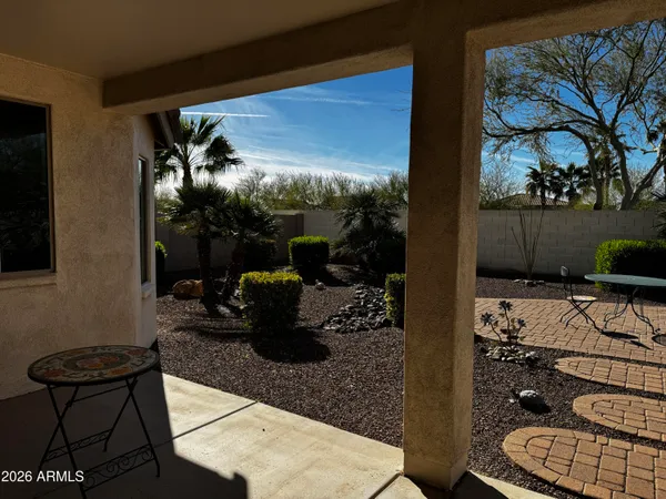 a view of a porch with furniture and yard