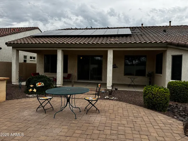 a view of a house with patio outdoor seating