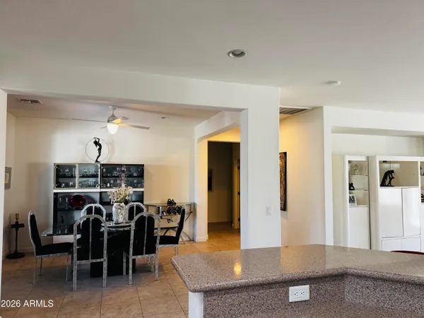 a living room with furniture a dining table and chairs