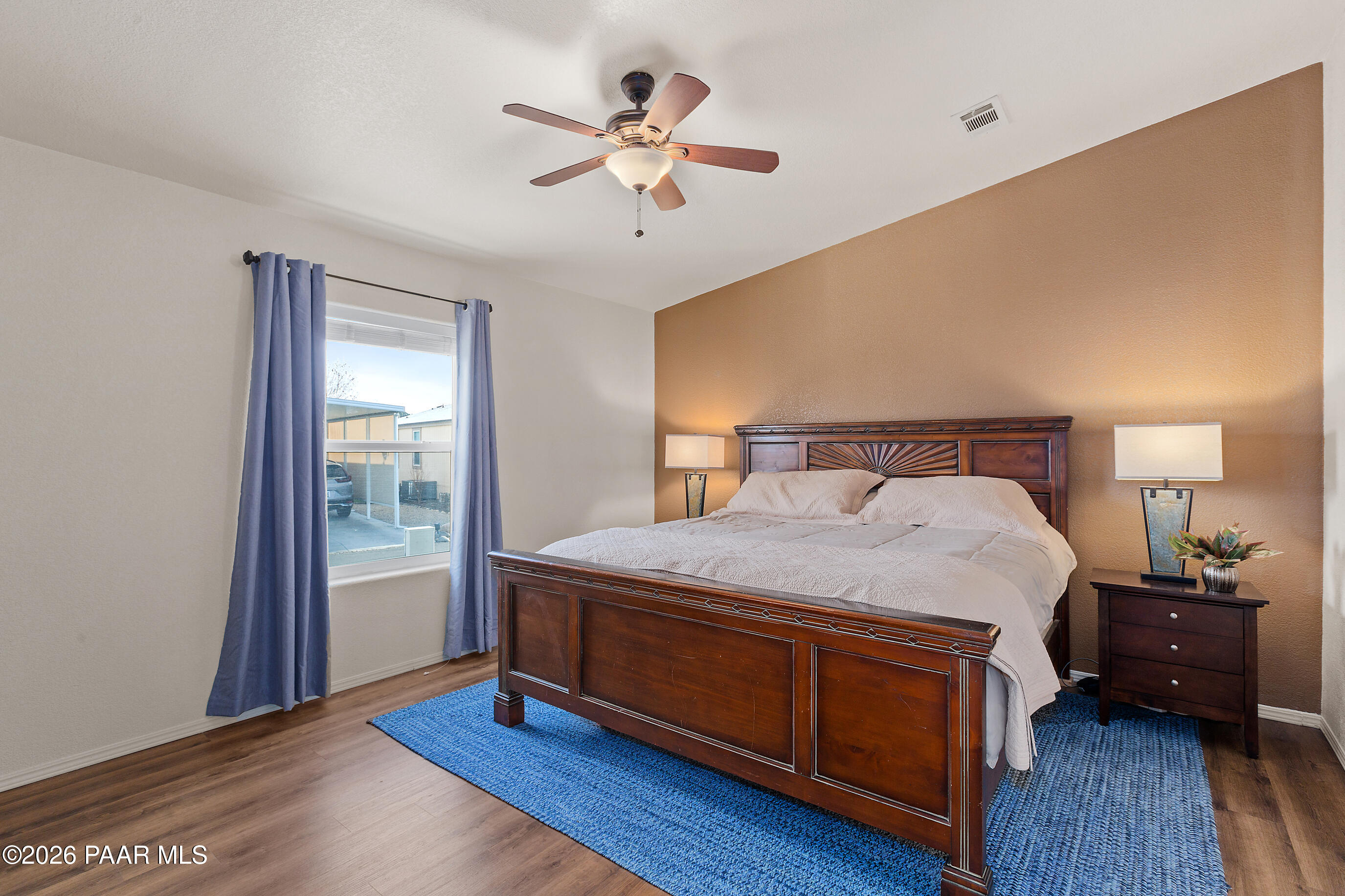 11250 East State Rte 69 Dewey, AZ 86327 - Photo 15 of 38 a bedroom with a bed and a ceiling fan