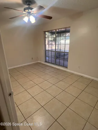 a view of an empty room with a window