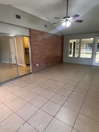 a view of an empty room with a window