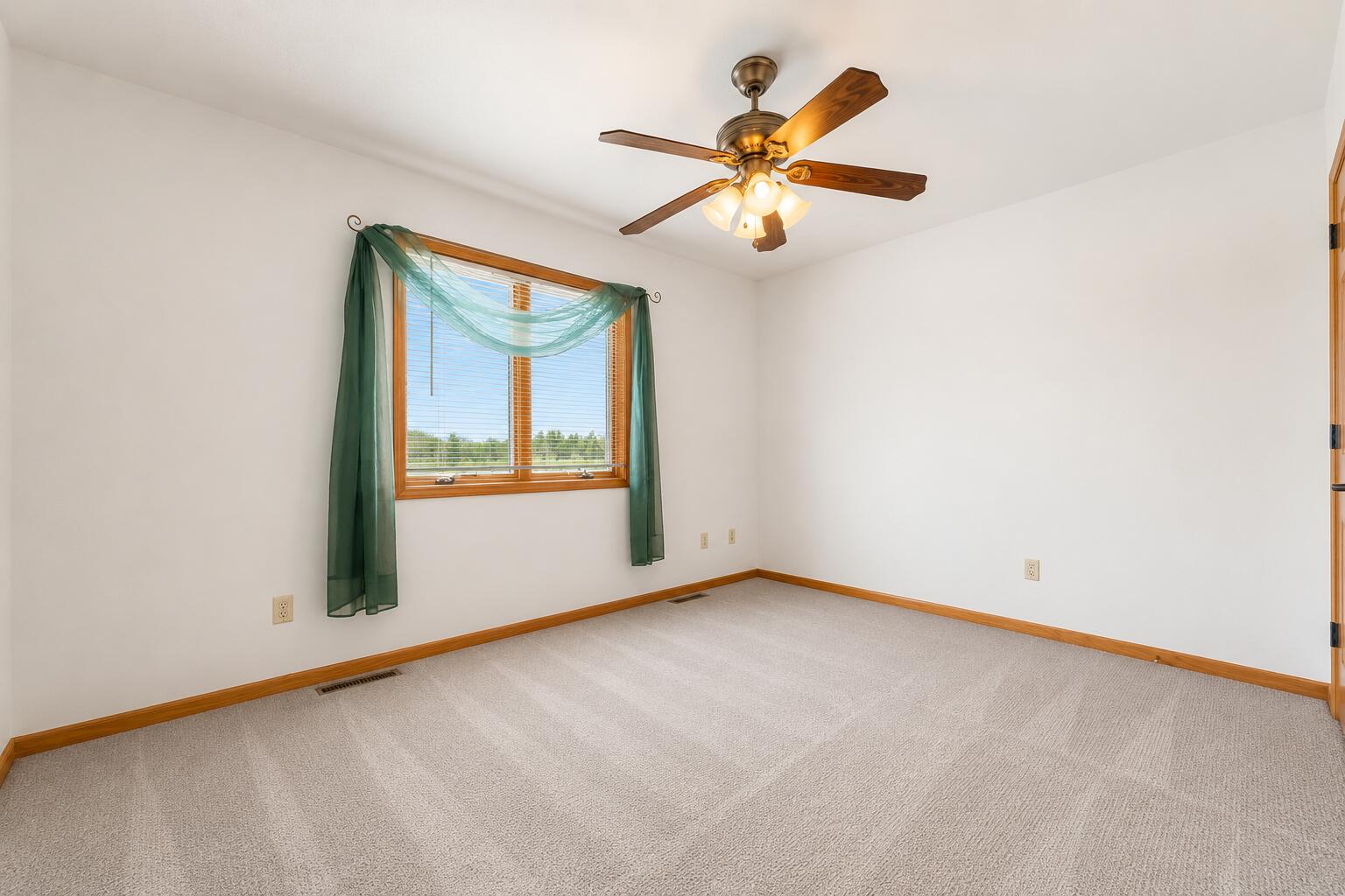 5005 West 152nd Court Crown Point, IN 46307 - Photo 15 of 22 an empty room with window and ceiling fan