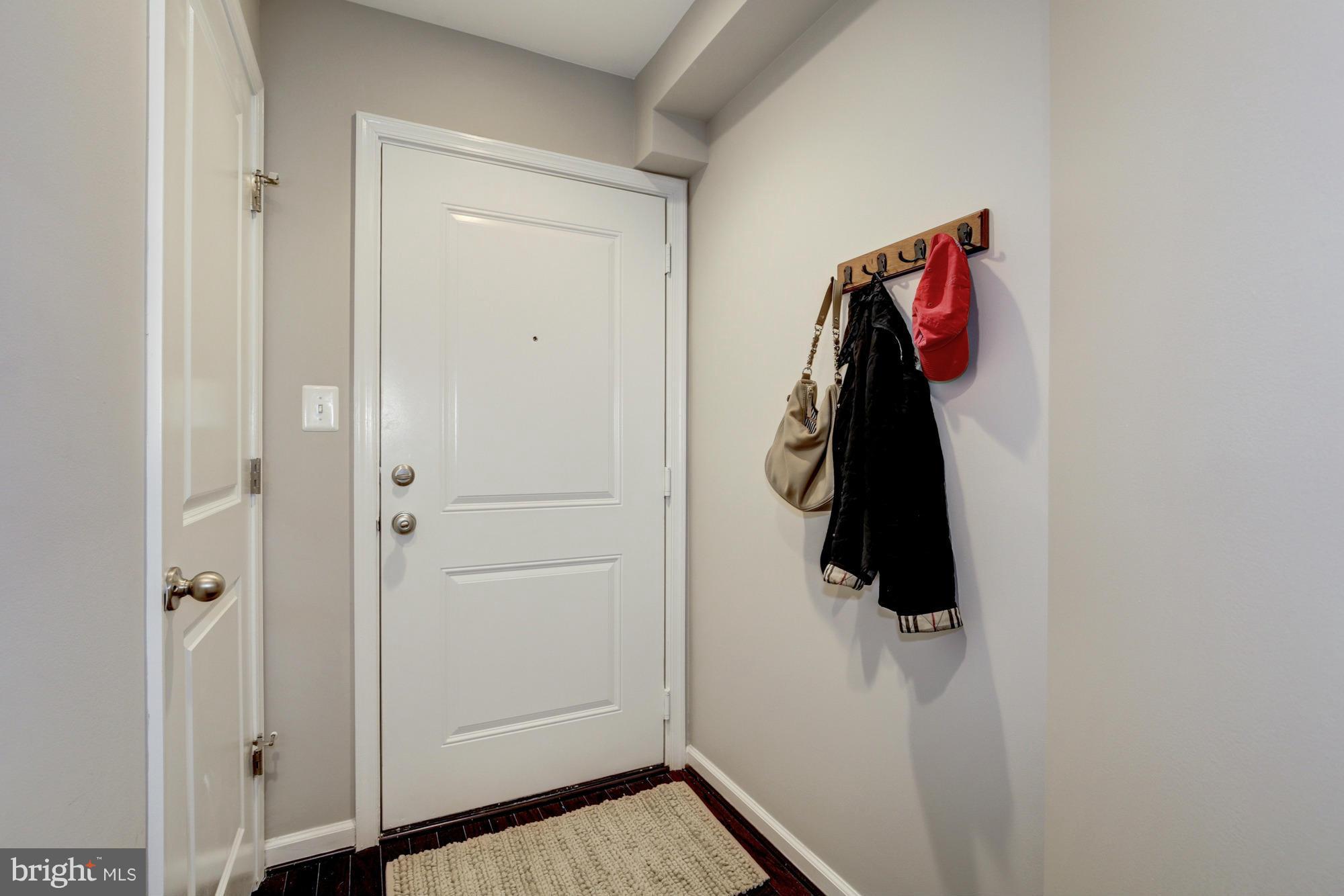 1845 Kalorama Road Northwest, Unit 1 Washington, DC 20009 - Photo 2 of 20 a view of walk in closet with clothes and shoes