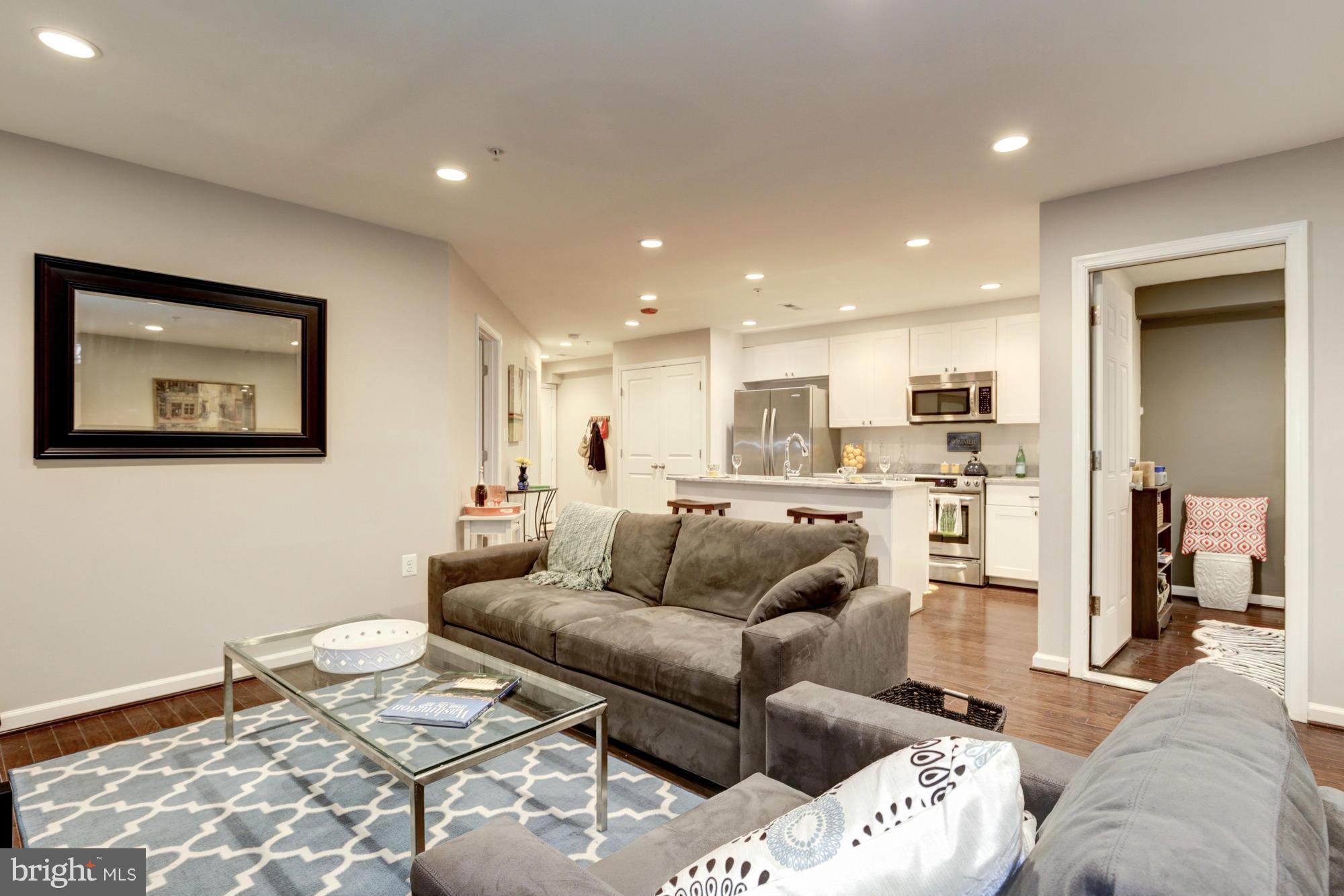 1845 Kalorama Road Northwest, Unit 1 Washington, DC 20009 - Photo 11 of 20 a living room with furniture and kitchen view