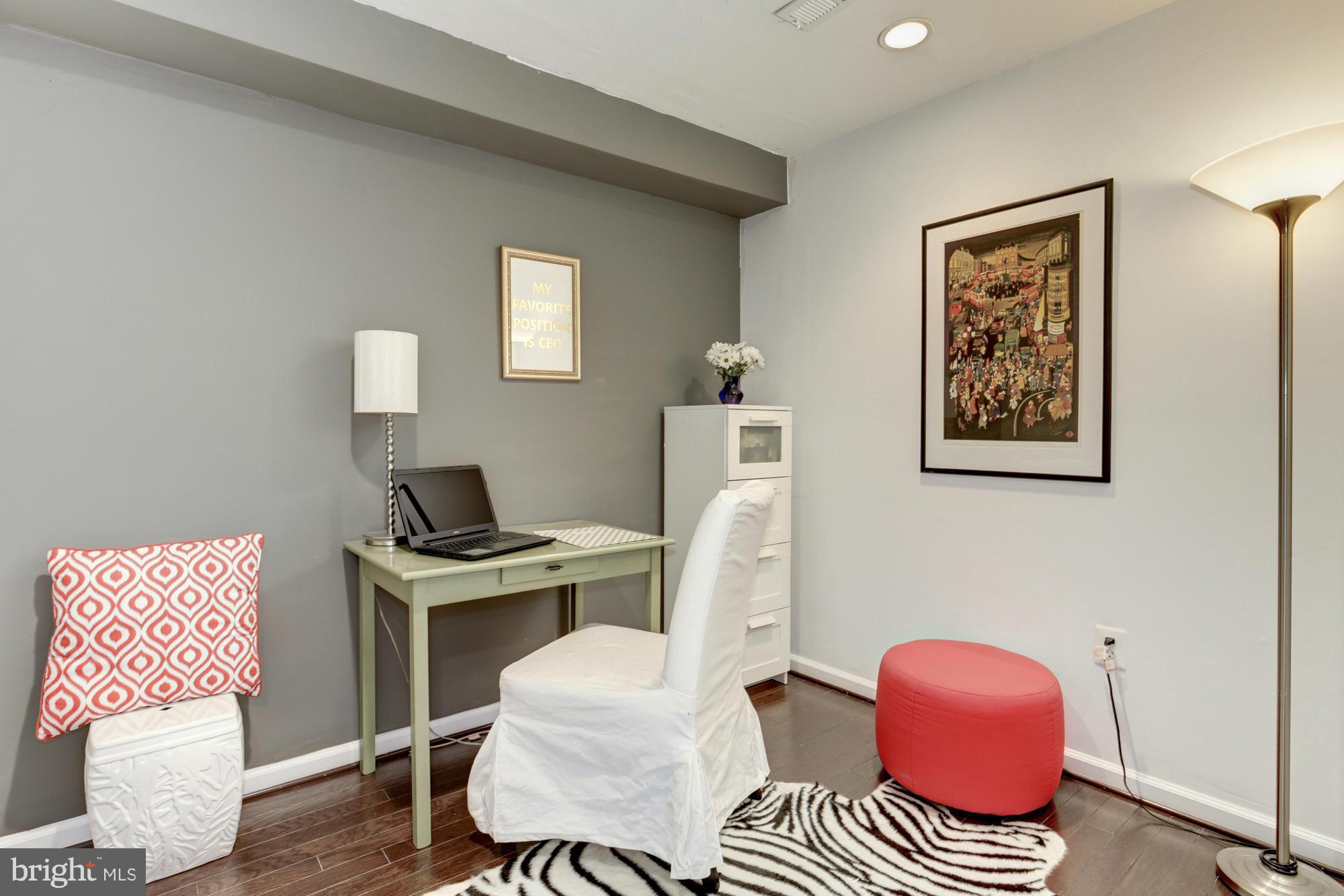 1845 Kalorama Road Northwest, Unit 1 Washington, DC 20009 - Photo 14 of 20 a bedroom with furniture and a window