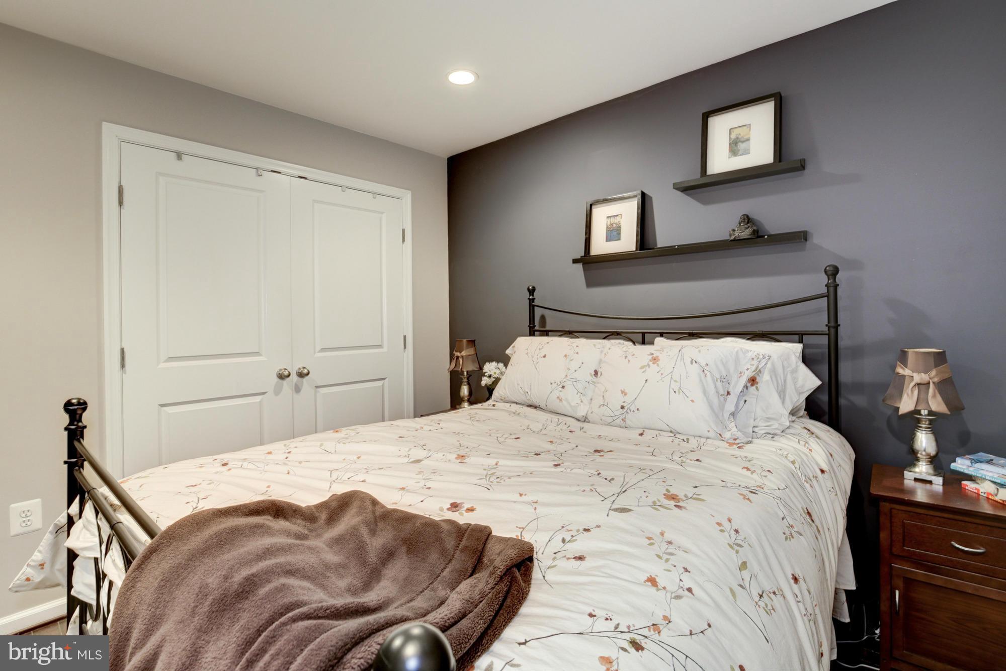 1845 Kalorama Road Northwest, Unit 1 Washington, DC 20009 - Photo 15 of 20 a bedroom with a bed and a lamp on dresser