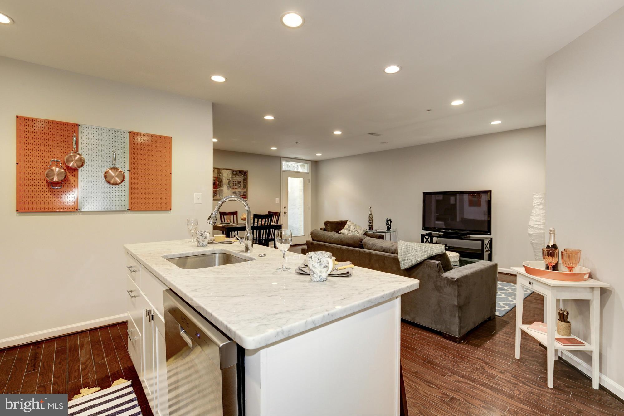1845 Kalorama Road Northwest, Unit 1 Washington, DC 20009 - Photo 3 of 20 a view of a dining room with furniture and wooden floor