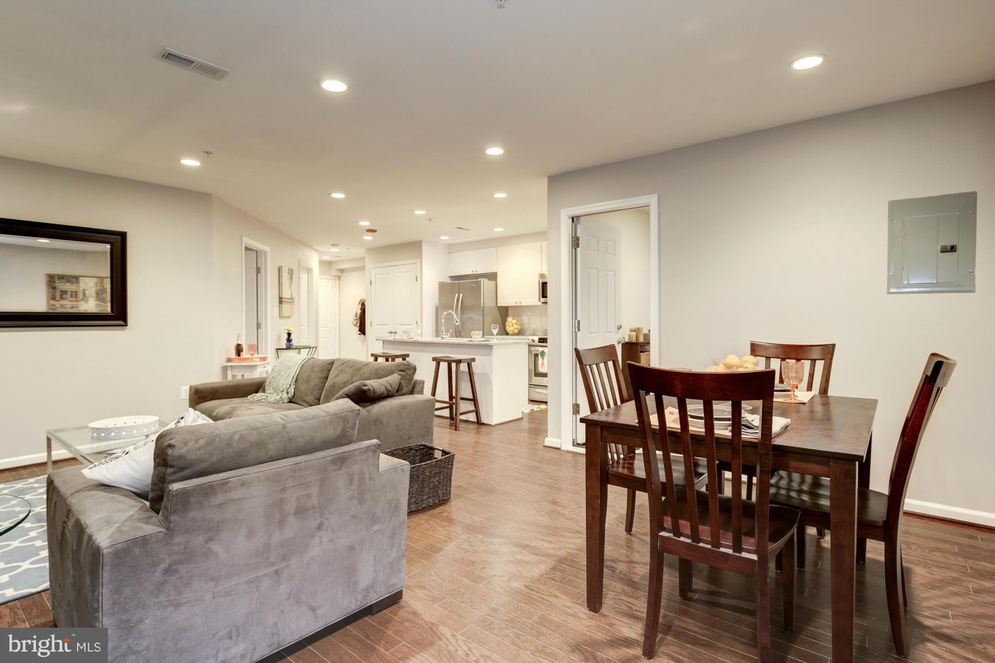 1845 Kalorama Road Northwest, Unit 1 Washington, DC 20009 - Photo 7 of 20 a living room with furniture wooden floor and a dining table