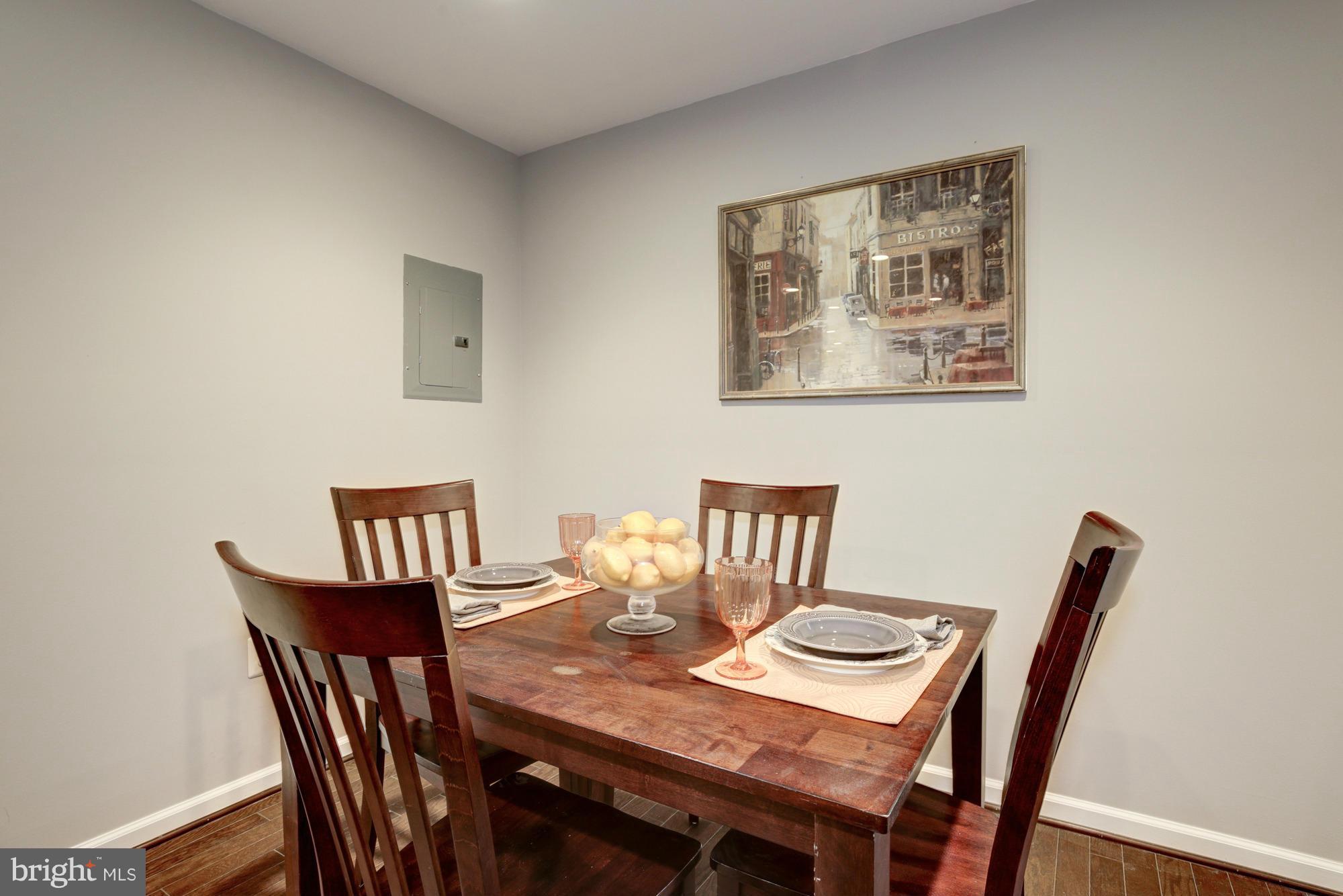 1845 Kalorama Road Northwest, Unit 1 Washington, DC 20009 - Photo 10 of 20 a view of a dining room with furniture and wooden floor