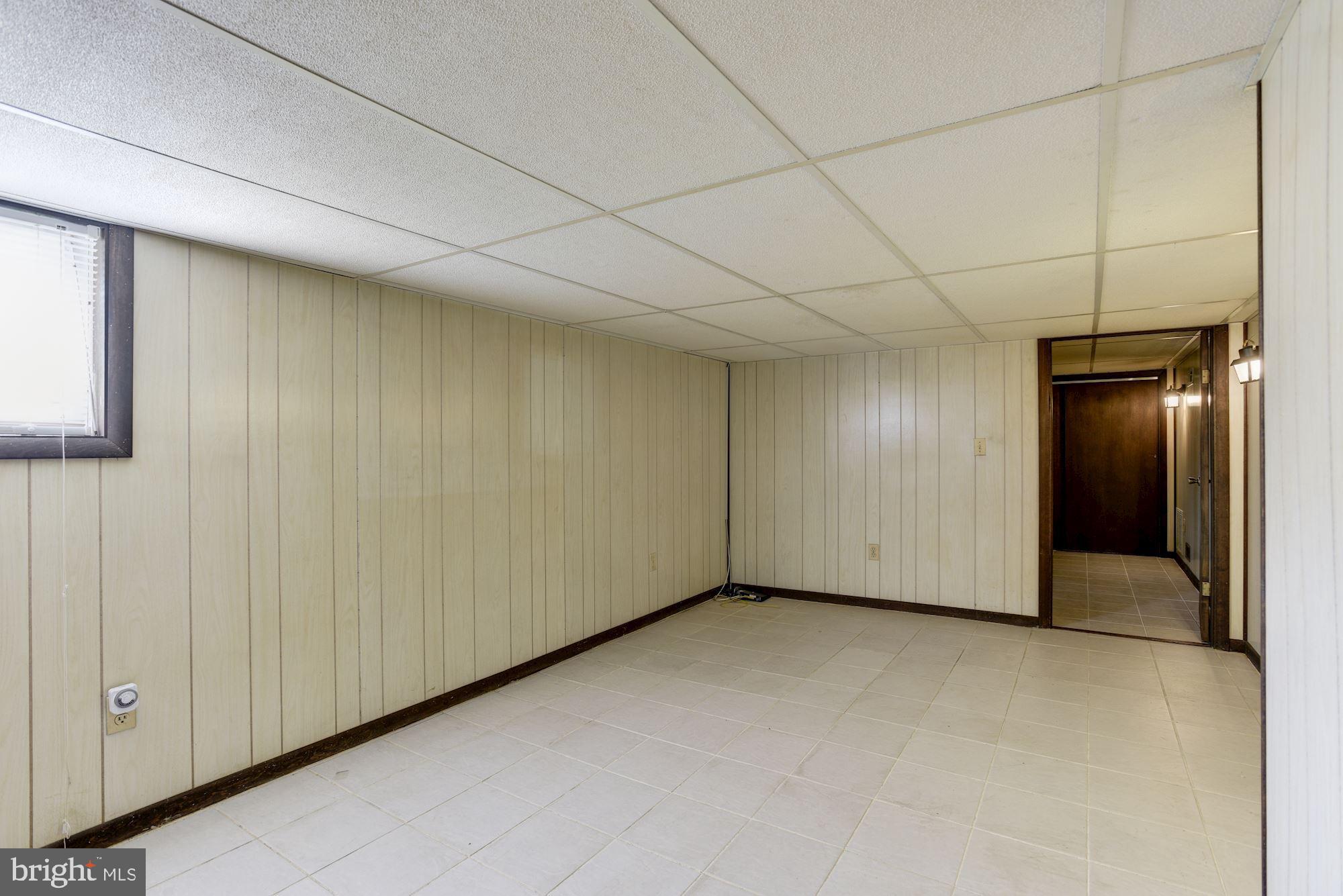 903 Arran Road Baltimore, MD 21239 - Photo 24 of 40 Finished tiled lower level family room.