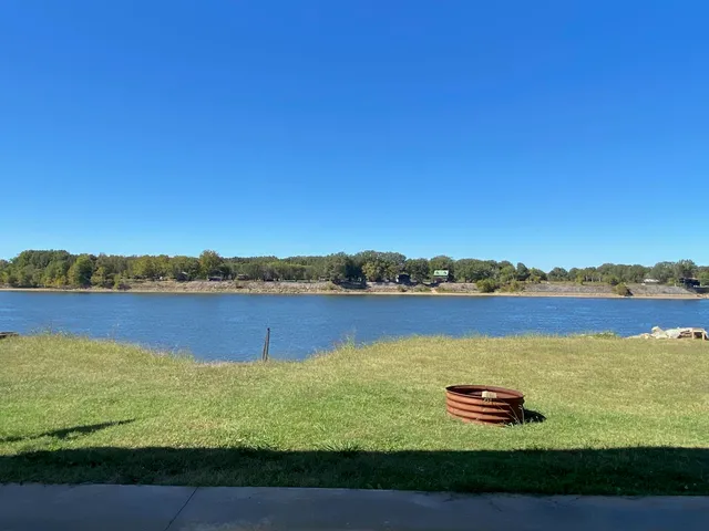 a view of a lake with houses in the back