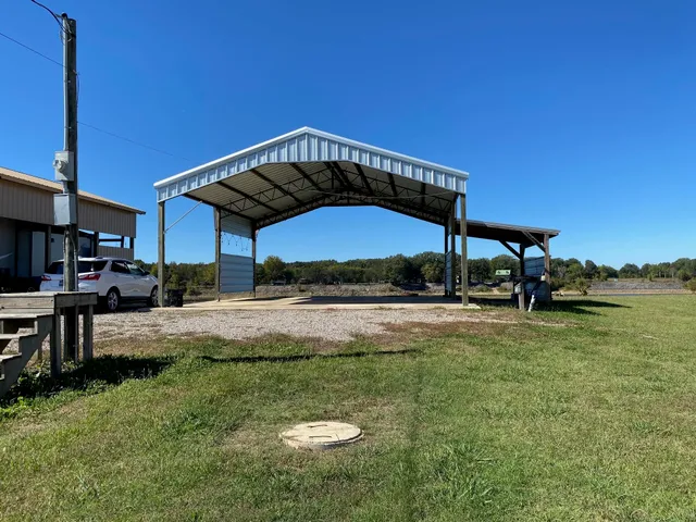 a view of a backyard with sitting area