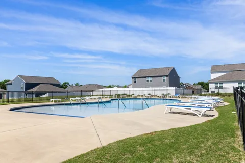 a view of a swimming pool with a lake view