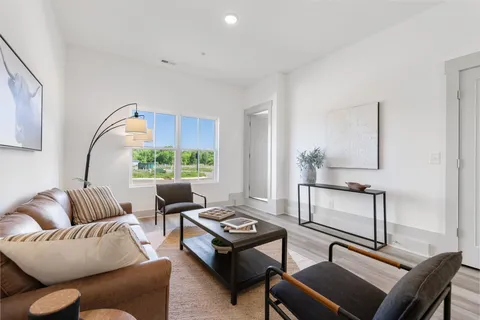 a living room with furniture and a window