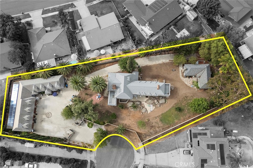 5130 Chequers Court Riverside, CA 92507 - Photo 1 of 1 an aerial view of a house with a swimming pool