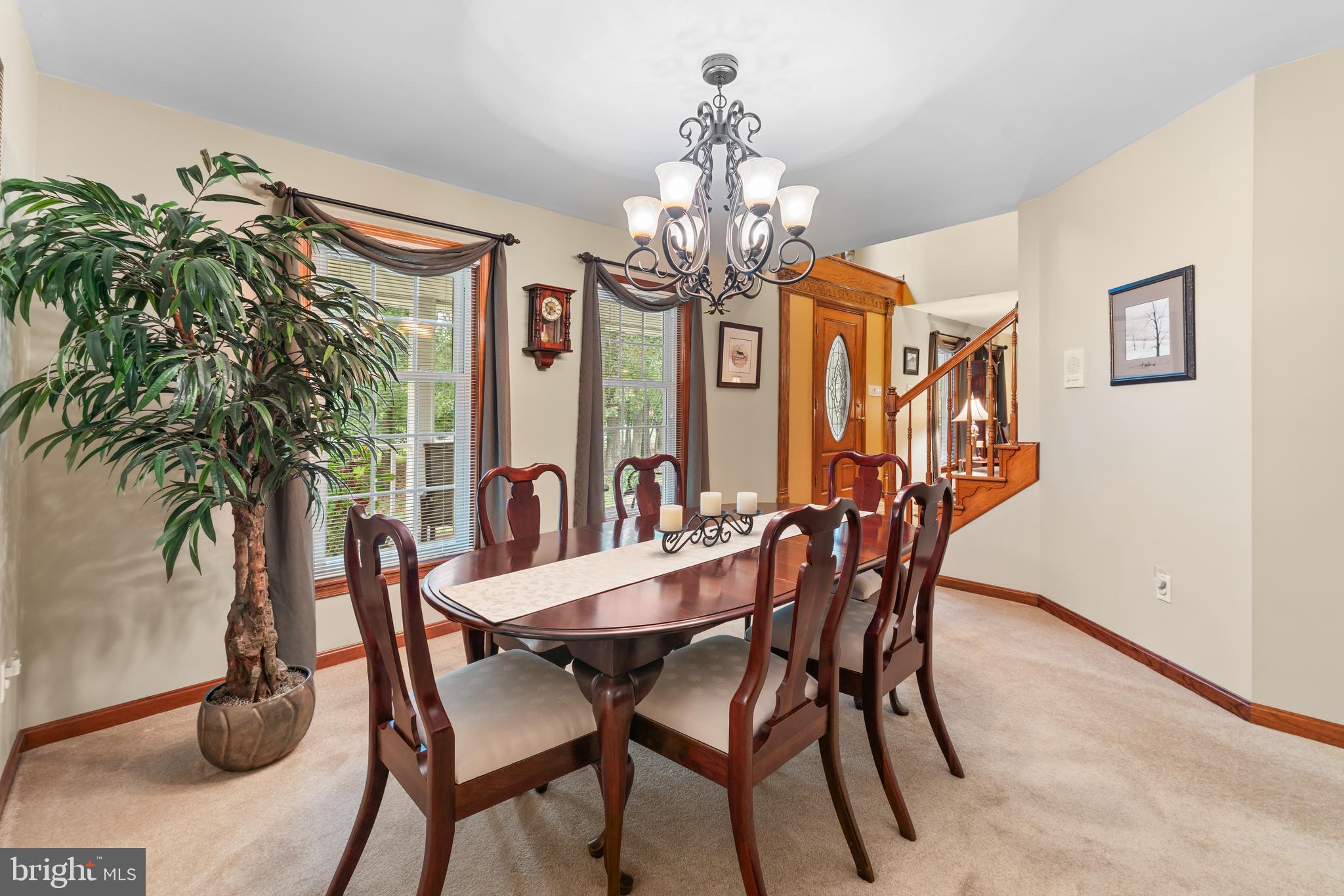 1433 Gilbert Road Arnold, MD 21012 - Photo 13 of 63 a view of a dining room with furniture a chandelier and wooden floor