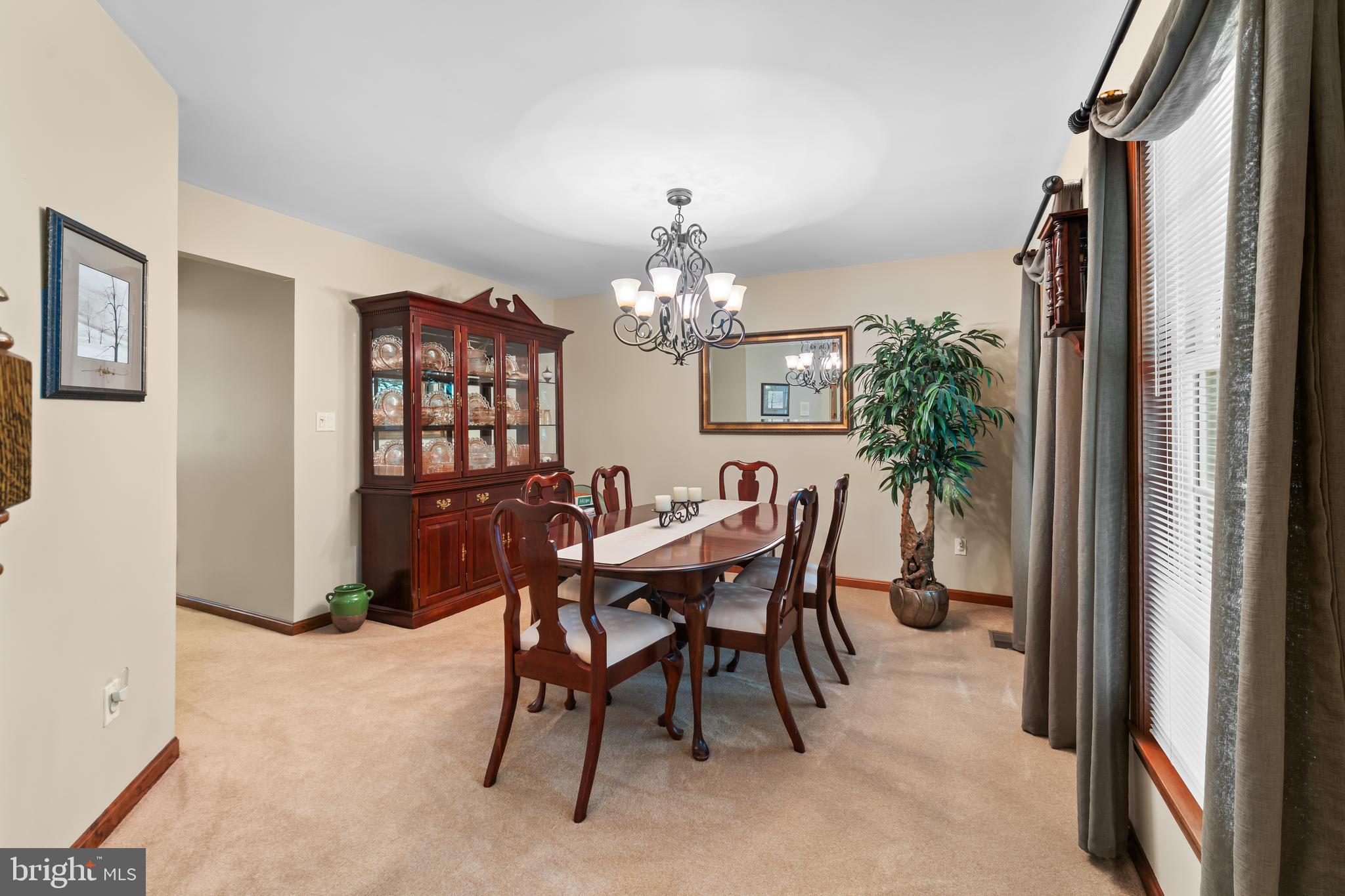 1433 Gilbert Road Arnold, MD 21012 - Photo 14 of 63 a view of a dining room with furniture and chandelier