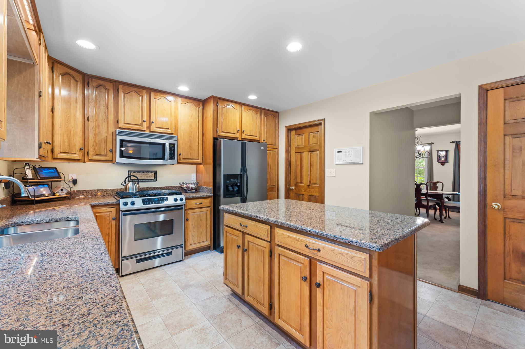 1433 Gilbert Road Arnold, MD 21012 - Photo 20 of 63 a kitchen with stainless steel appliances granite countertop a stove refrigerator sink and microwave