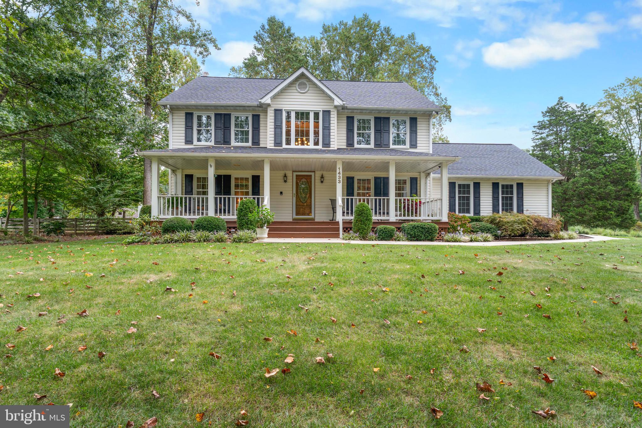 1433 Gilbert Road Arnold, MD 21012 - Photo 2 of 63 a front view of a house with a yard table and chairs