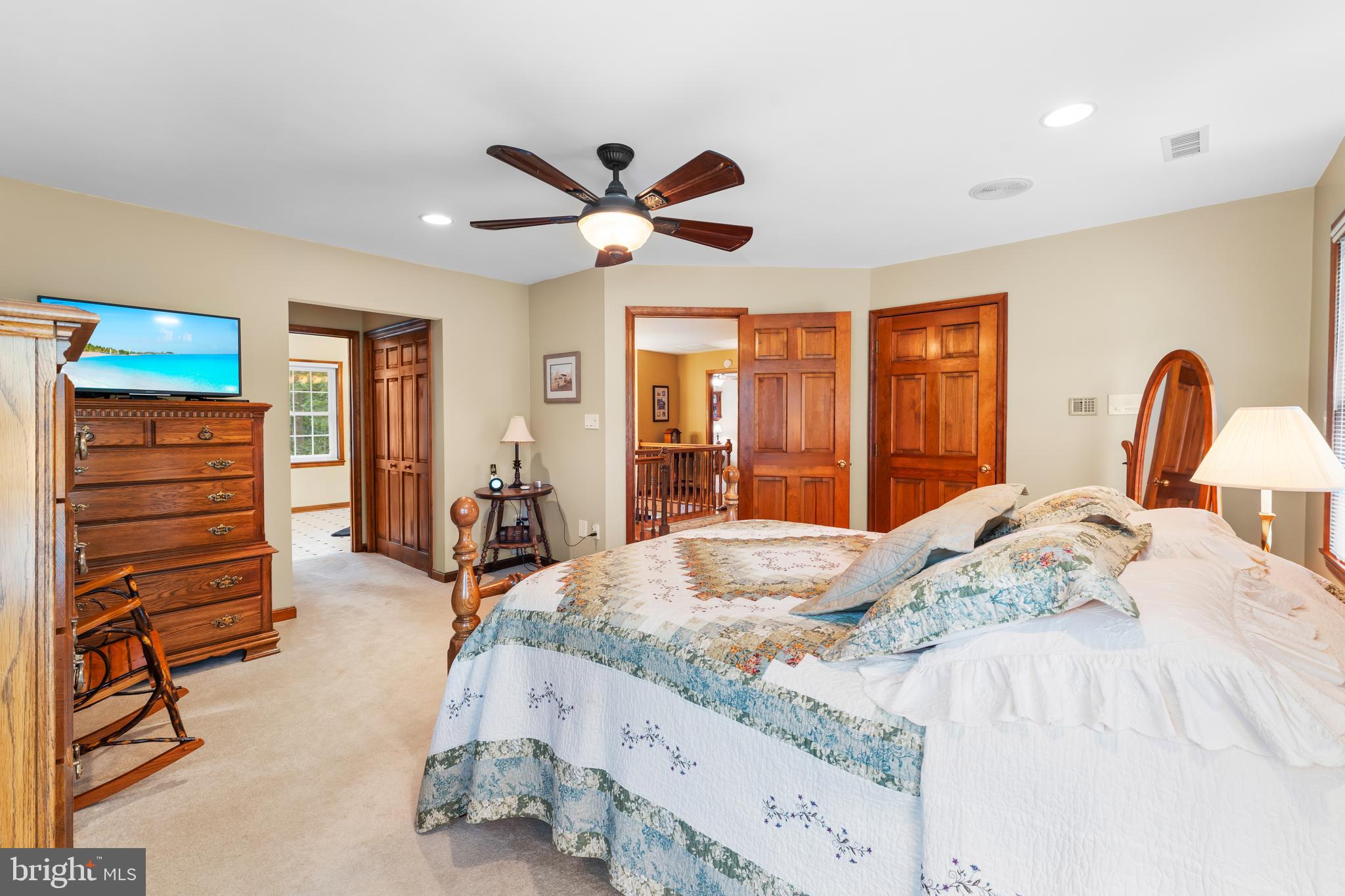 1433 Gilbert Road Arnold, MD 21012 - Photo 28 of 63 a bedroom with a bed and wooden floor