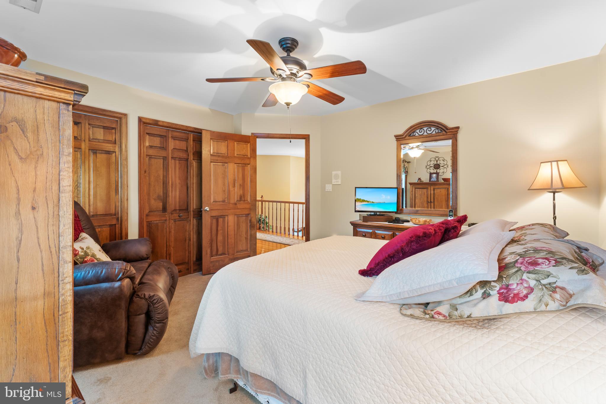 1433 Gilbert Road Arnold, MD 21012 - Photo 35 of 63 a bedroom with a bed and a chandelier