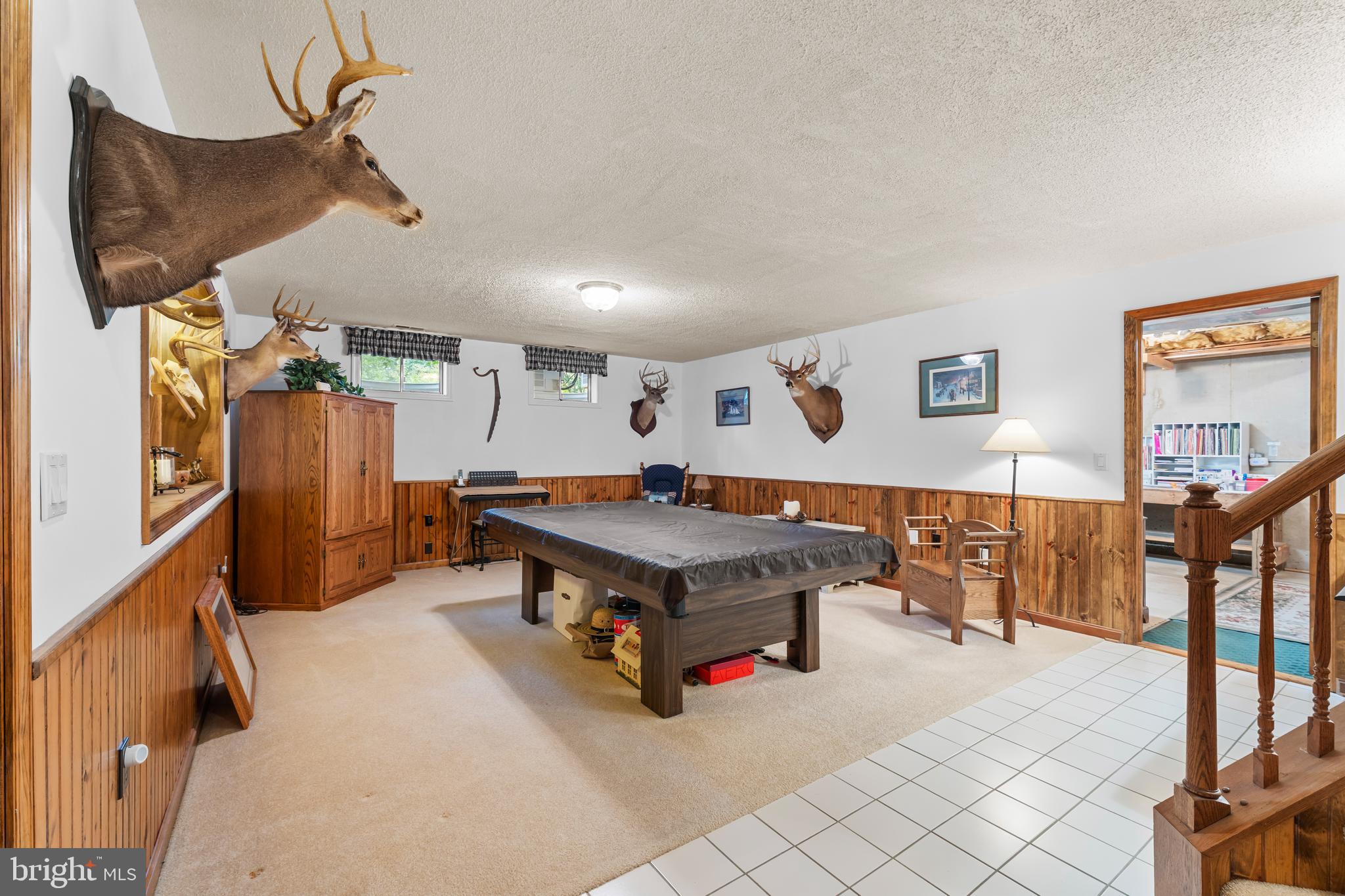 1433 Gilbert Road Arnold, MD 21012 - Photo 36 of 63 a living room with furniture a flat screen tv and a table