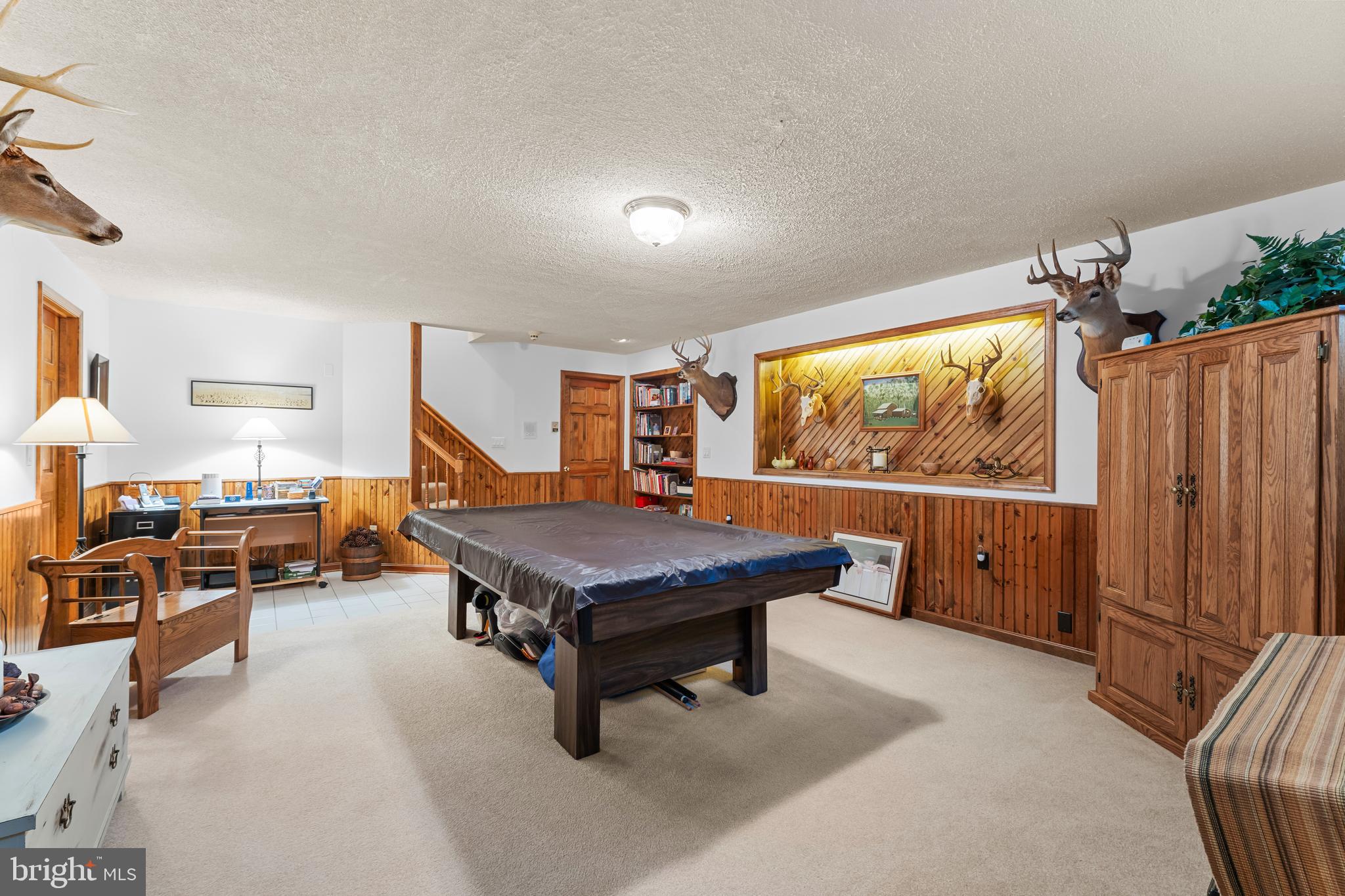 1433 Gilbert Road Arnold, MD 21012 - Photo 37 of 63 a living room with furniture a flat screen tv and a large window