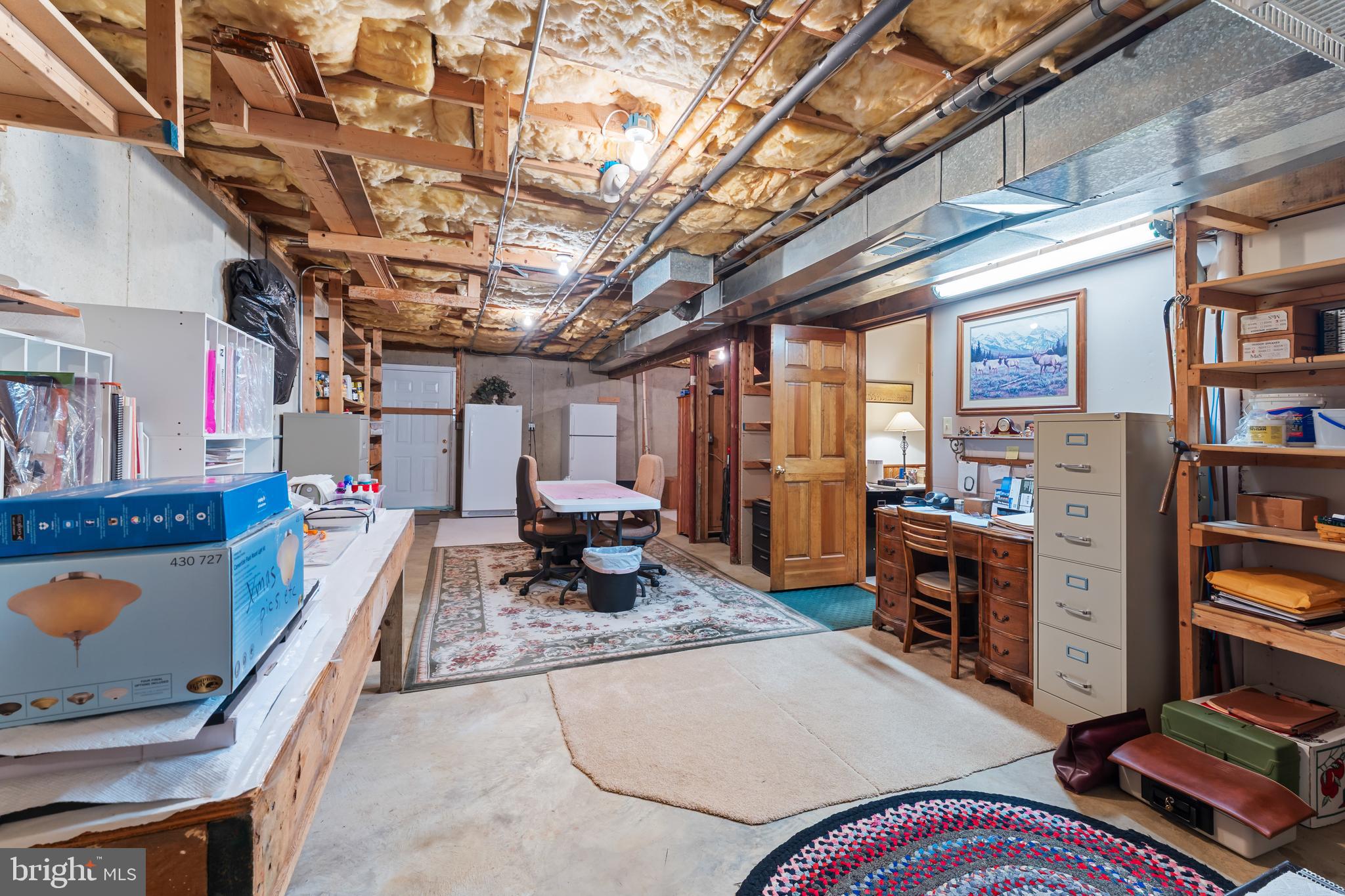 1433 Gilbert Road Arnold, MD 21012 - Photo 39 of 63 a living room with lots of furniture and clutter