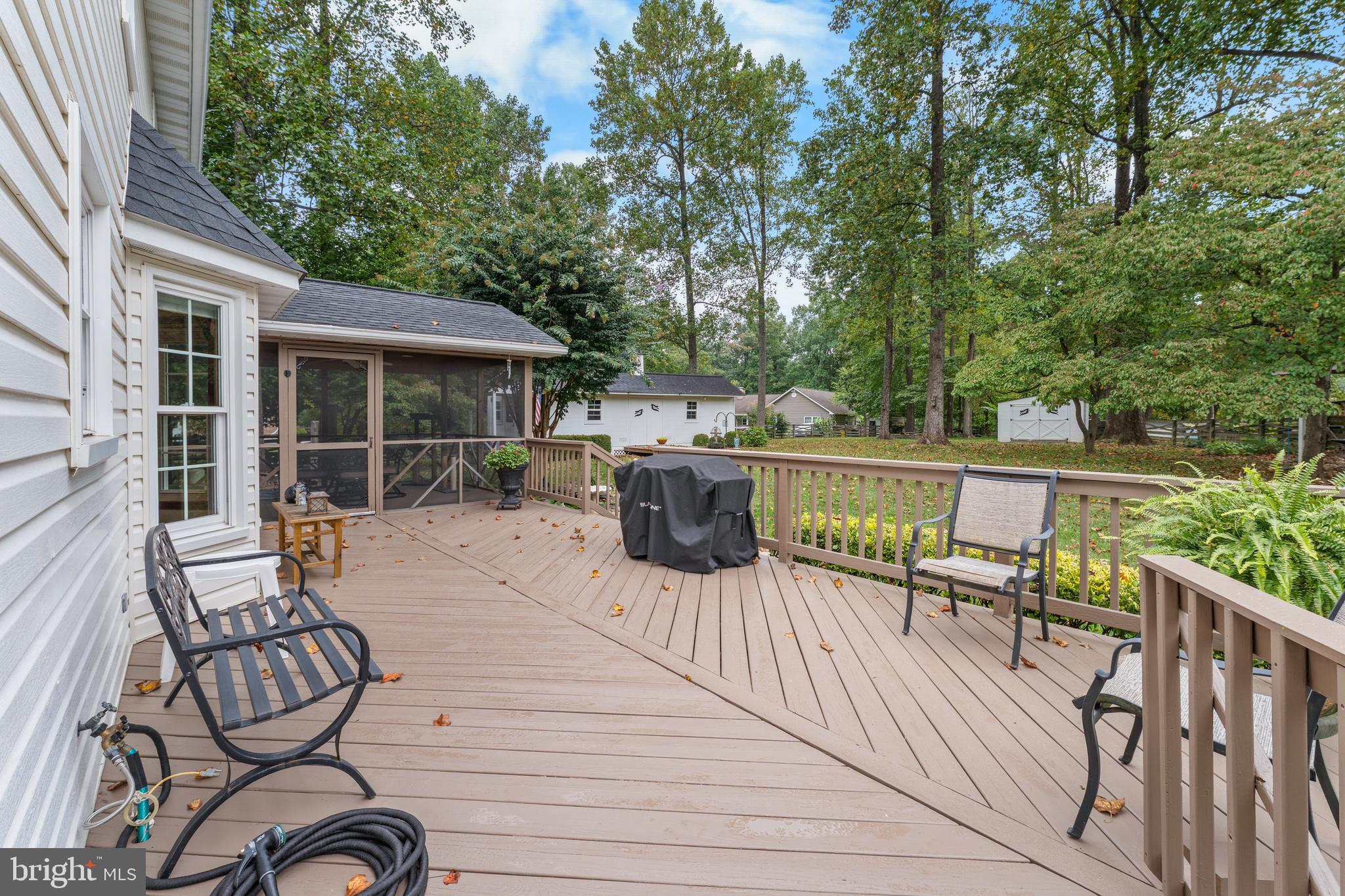 1433 Gilbert Road Arnold, MD 21012 - Photo 44 of 63 a view of a deck with furniture and trees