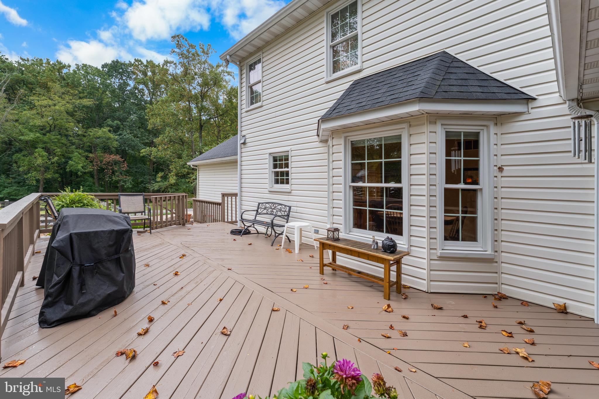 1433 Gilbert Road Arnold, MD 21012 - Photo 45 of 63 a view of a deck with table and chairs and wooden floor