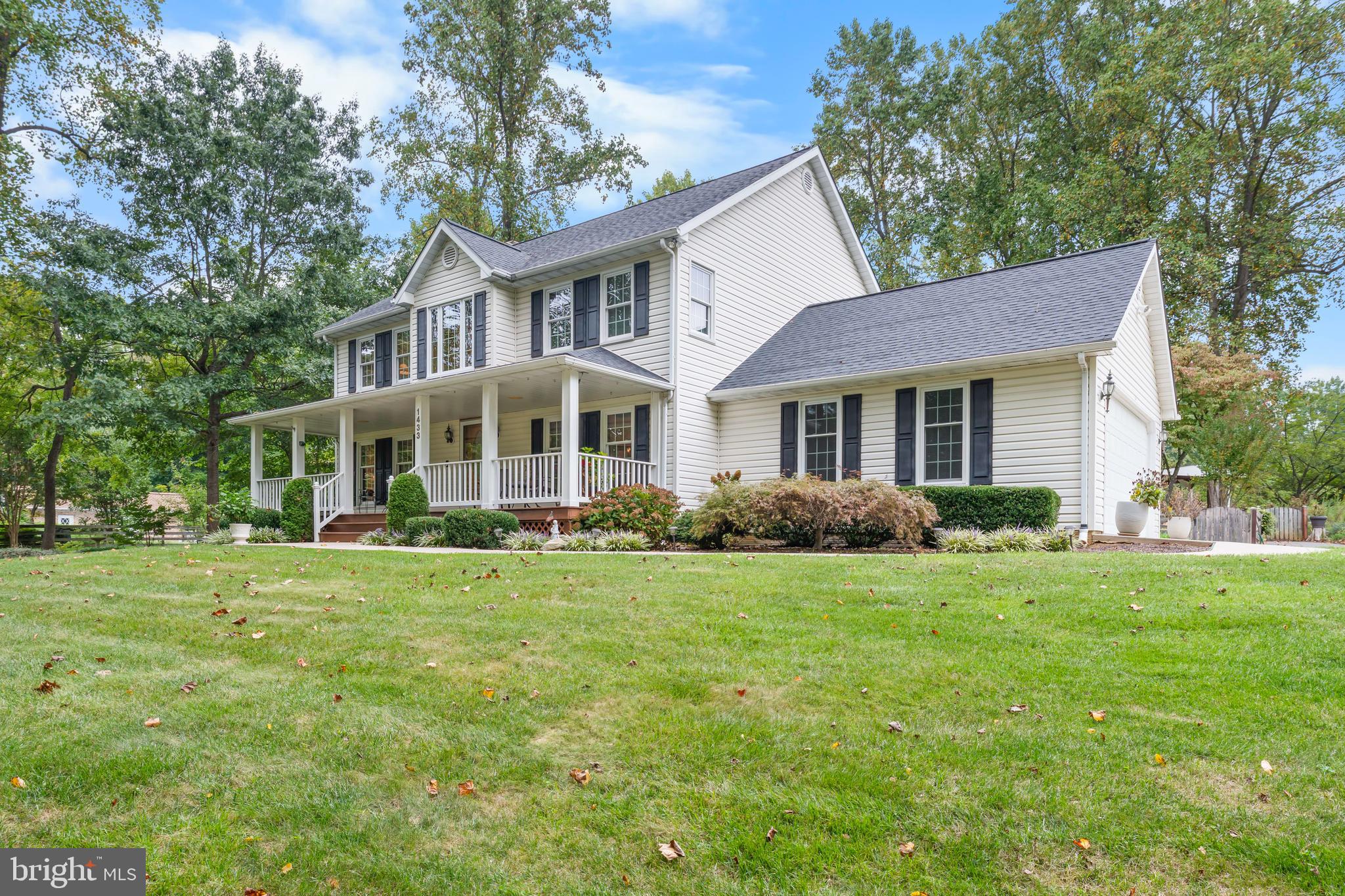 1433 Gilbert Road Arnold, MD 21012 - Photo 5 of 63 a front view of a house with a yard and trees