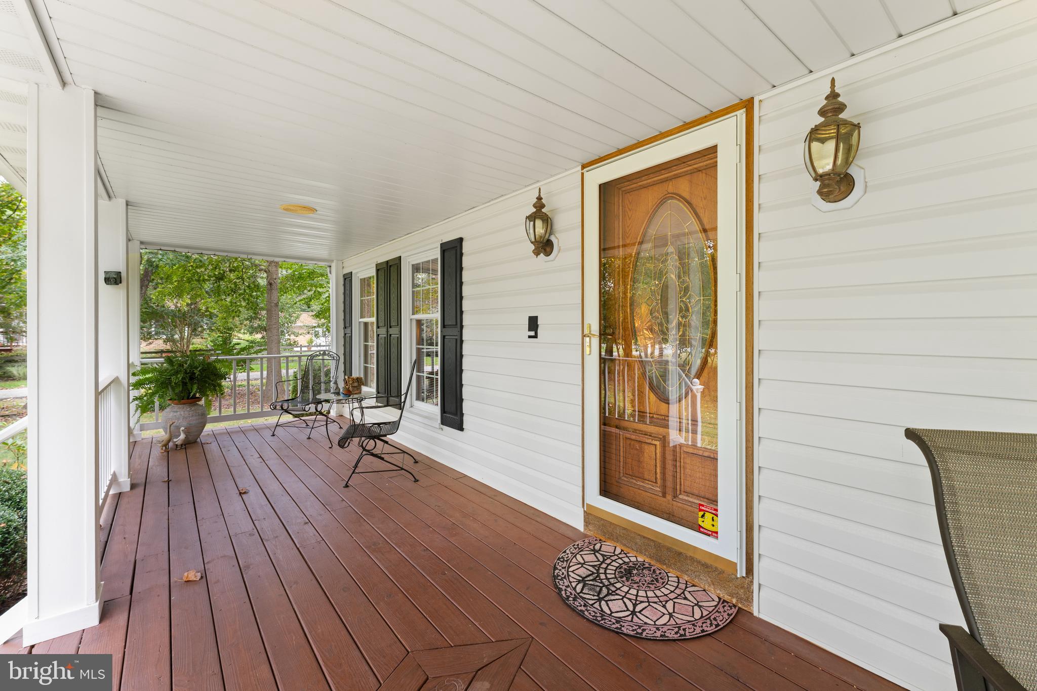 1433 Gilbert Road Arnold, MD 21012 - Photo 6 of 63 a view of a hallway with wooden floor and glass door