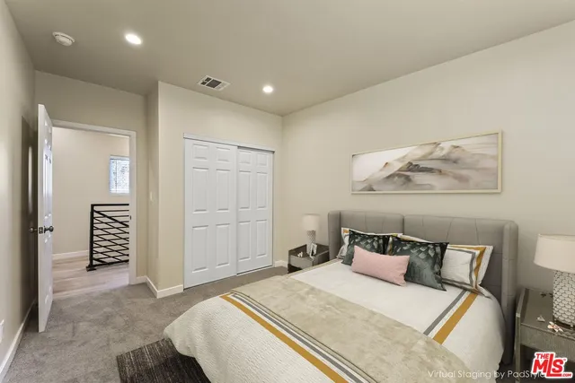 a bedroom with a bed and a walk in closet