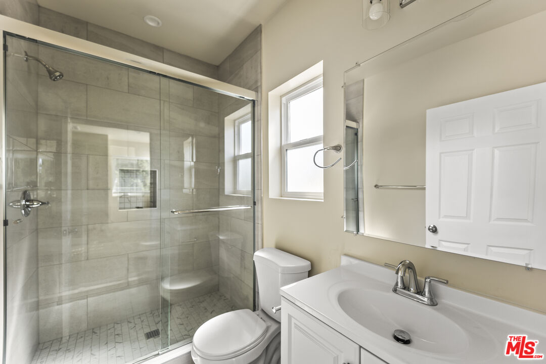 5741 Simpson Avenue Valley Village, CA 91601 - Photo 9 of 11 a bathroom with a sink a toilet and shower