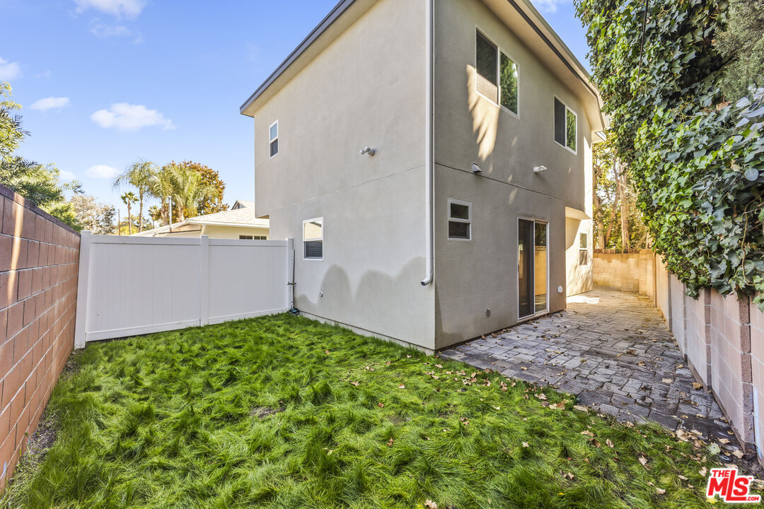 5741 Simpson Avenue Valley Village, CA 91601 - Photo 10 of 11 a backyard of a house with lots of green space