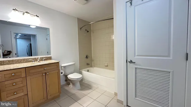 a view of a hallway with washer and dryer