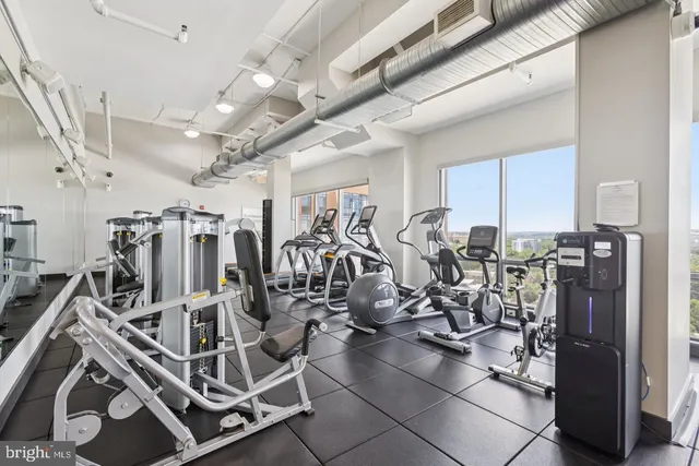 a view of a dining room with furniture and a kitchen