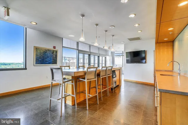 a view of a patio with chairs and table